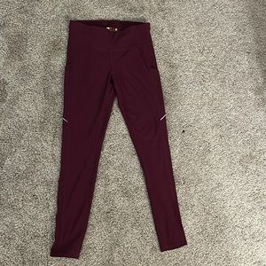 maroon leggings, athletic material